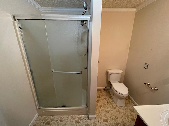 bathroom featuring toilet, a stall shower, ornamental molding, and a textured ceiling