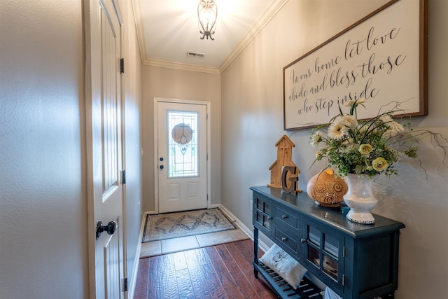  - foyer entrance with ornamental molding, dark wood-style flooring, and baseboards