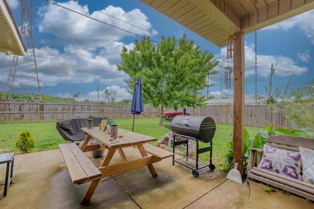  - view of patio / terrace featuring outdoor dining area and a grill
