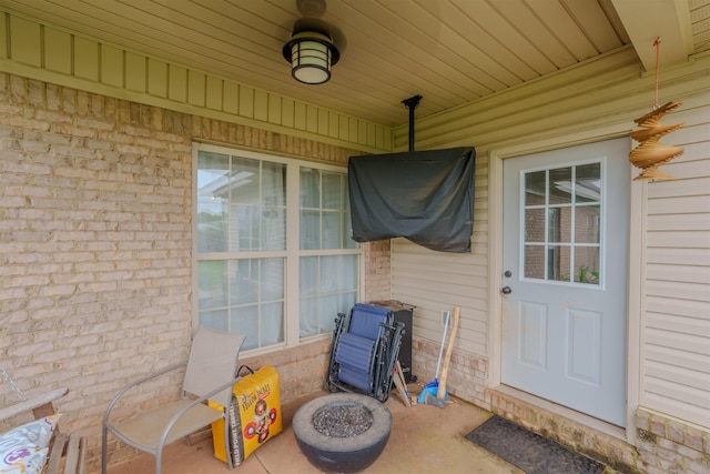  - entrance to property featuring brick siding