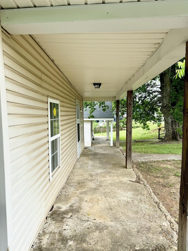 view of patio / terrace featuring covered porch and an attached carport