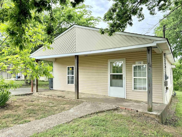 rear view of property featuring a patio area