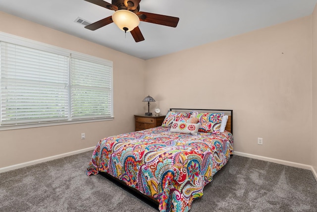 carpeted bedroom featuring baseboards and ceiling fan