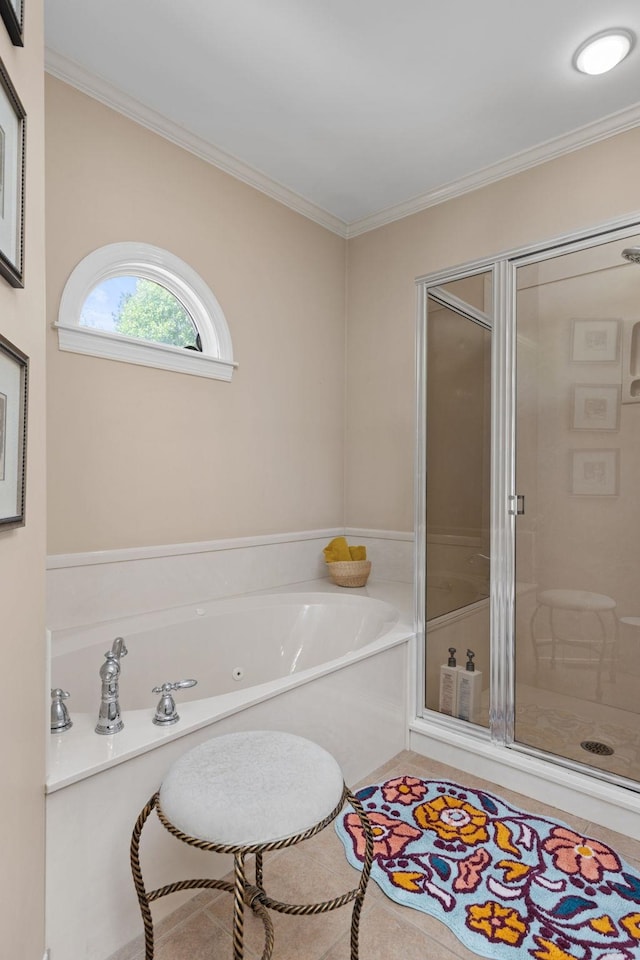 full bathroom featuring a stall shower, a garden tub, and crown molding