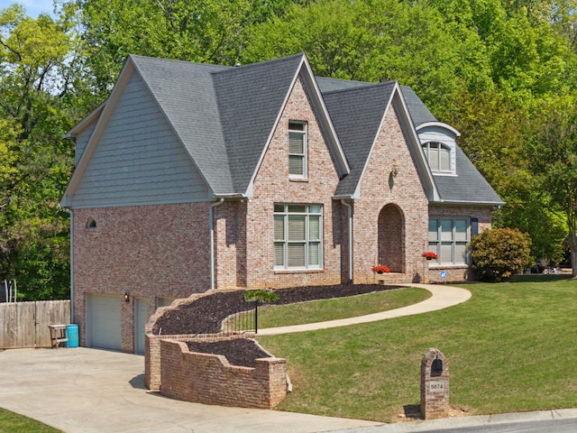 view of front of house featuring brick siding, concrete driveway, a garage, and roof with shingles