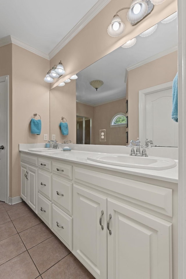 bathroom featuring tile patterned floors, double vanity, and ornamental molding