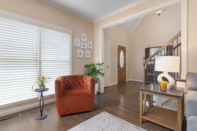 foyer entrance featuring ornamental molding, vaulted ceiling, stairs, wood finished floors, and baseboards