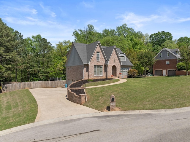 traditional-style house featuring brick siding, concrete driveway, and a garage