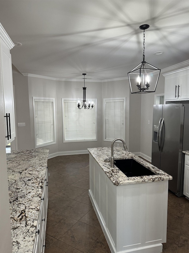  - kitchen with stainless steel refrigerator with ice dispenser, a chandelier, white cabinets, light stone countertops, and ornamental molding