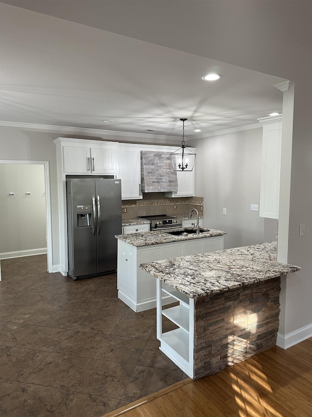  - kitchen with stainless steel appliances, exhaust hood, crown molding, backsplash, and white cabinetry