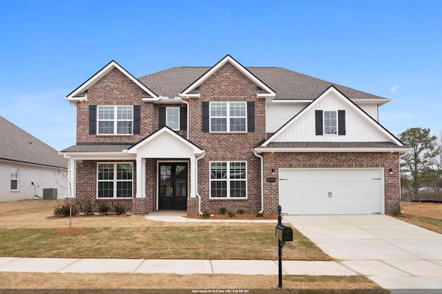 craftsman-style home with a garage, central AC, a front yard, and french doors