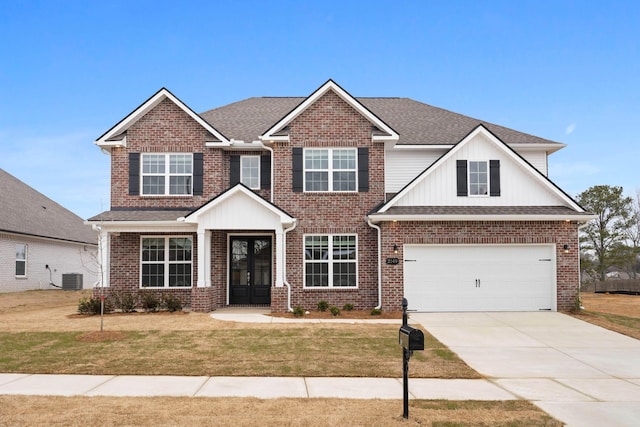 craftsman house with central air condition unit, french doors, a front lawn, and a garage