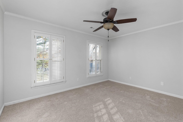 unfurnished room featuring ceiling fan, ornamental molding, and light carpet