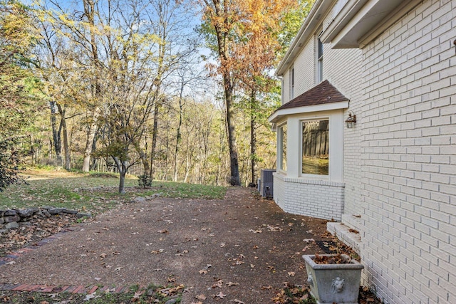 view of yard with central AC unit