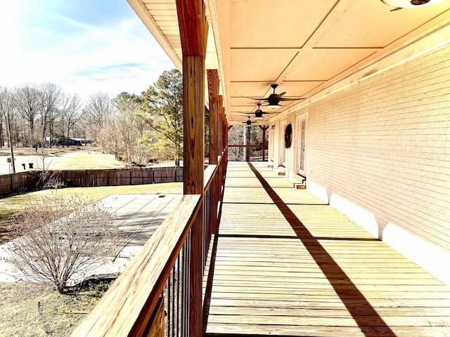 wooden deck featuring ceiling fan