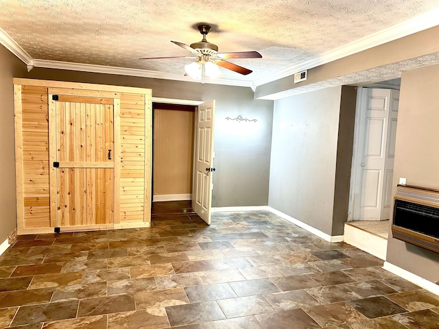 unfurnished bedroom with crown molding, ceiling fan, a textured ceiling, and heating unit