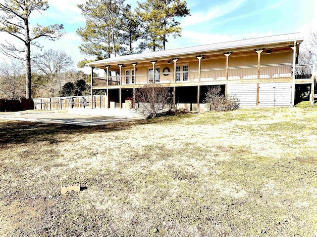 exterior space with a patio, ceiling fan, and a lawn