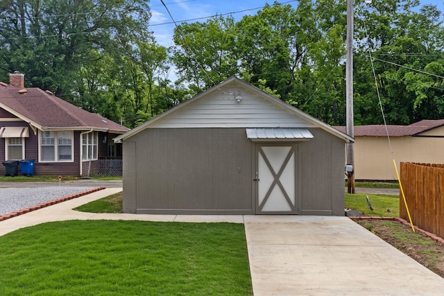  - view of outbuilding featuring fence and an outbuilding