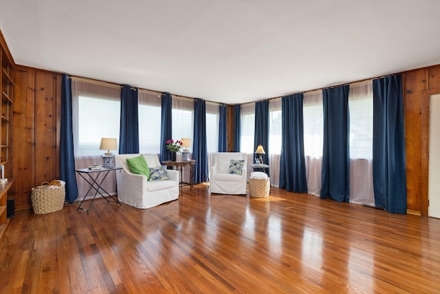  - sitting room featuring wood finished floors