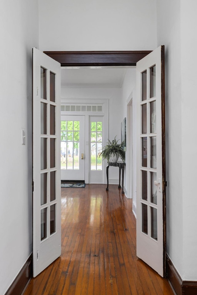  - hall featuring wood-type flooring and french doors