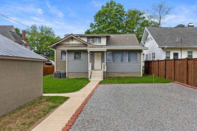  - back of property featuring a lawn, crawl space, fence, and cooling unit
