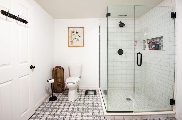 bathroom featuring walk in shower and toilet