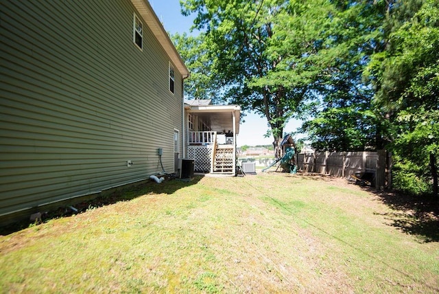 view of yard featuring a playground and central AC