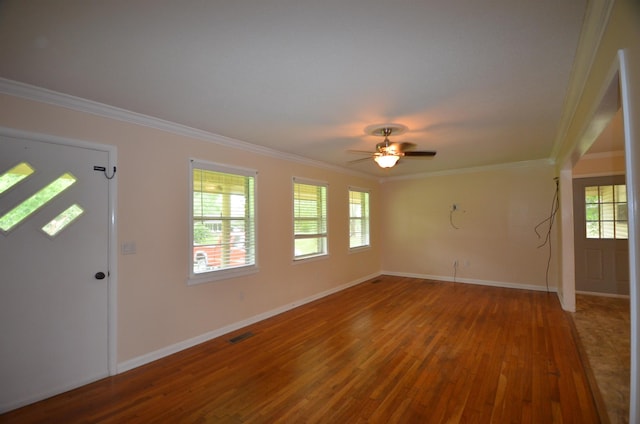 entrance foyer featuring ceiling fan, wood-type flooring, and ornamental molding