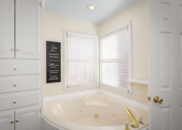 bathroom with a jetted tub