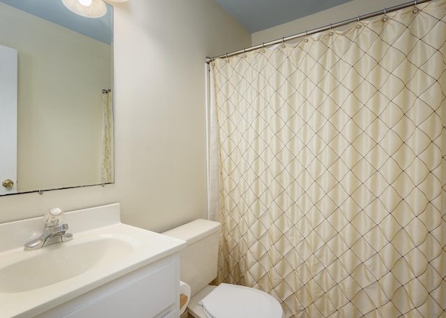 full bathroom featuring vanity and toilet