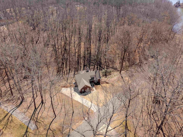 drone / aerial view featuring a forest view