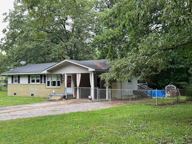 ranch-style house featuring a front yard, a shingled roof, and fence