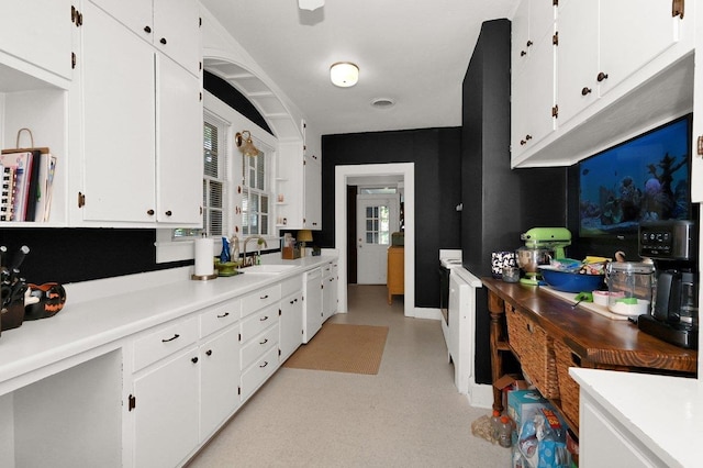 kitchen with white cabinets and sink