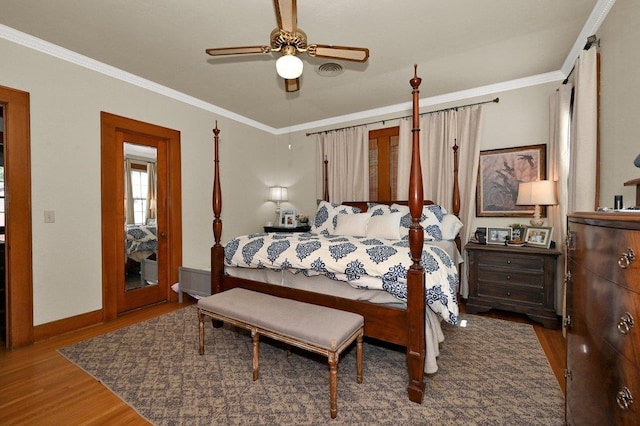 bedroom with dark hardwood / wood-style floors, ceiling fan, and crown molding