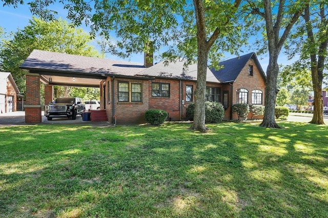 view of front of property with a carport and a front yard