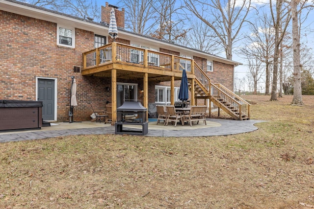 back of property with a patio, a yard, and a deck