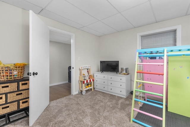 rec room featuring a paneled ceiling and light colored carpet