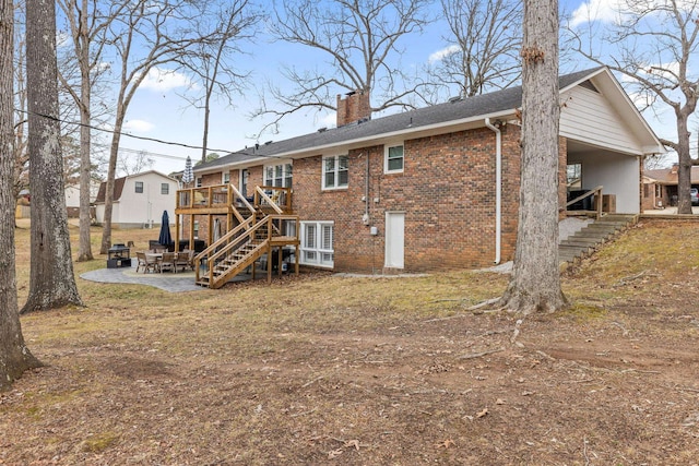 rear view of house featuring a deck and a patio