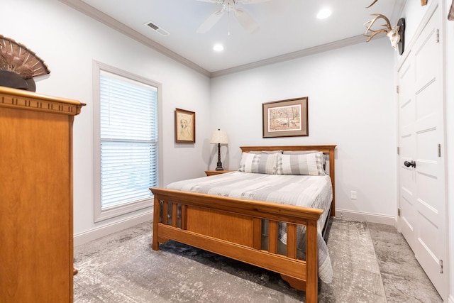 bedroom featuring ceiling fan, crown molding, and carpet