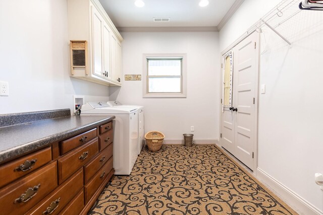 laundry room with washer and clothes dryer, cabinets, and ornamental molding