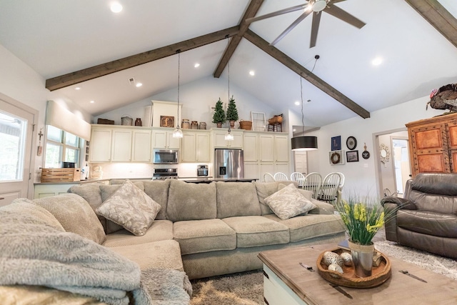 living room with beam ceiling, ceiling fan, and high vaulted ceiling