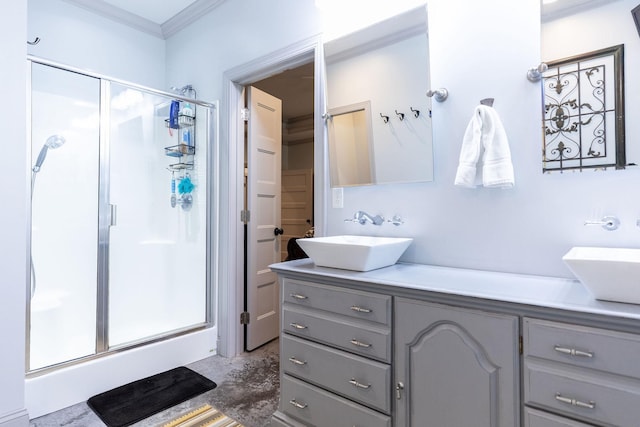 bathroom with vanity, walk in shower, and crown molding