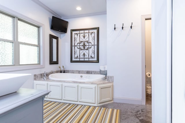 bathroom featuring a washtub and crown molding