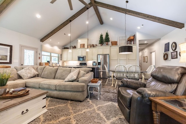 living room with beam ceiling and high vaulted ceiling