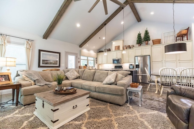 living room featuring beamed ceiling, carpet floors, and high vaulted ceiling