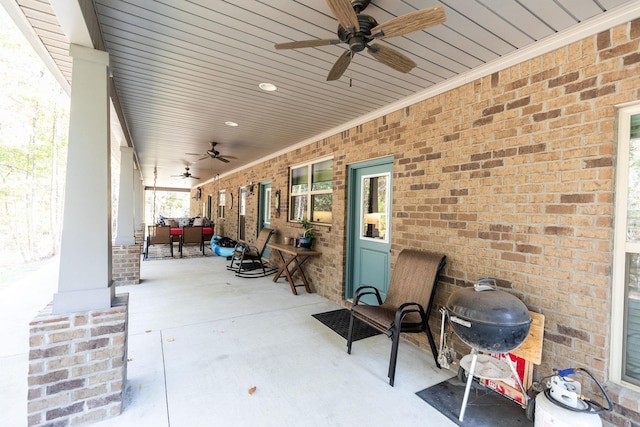 view of patio with ceiling fan and area for grilling