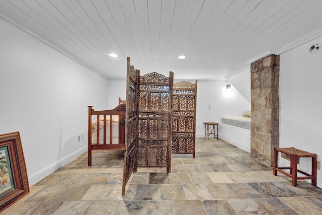 bedroom with ornamental molding and wood ceiling