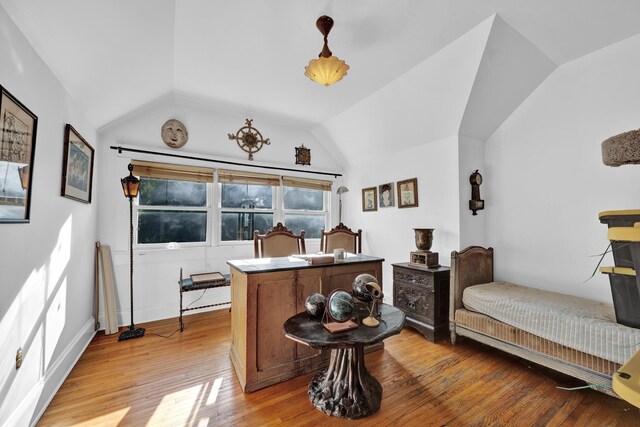 interior space featuring lofted ceiling and light wood-type flooring