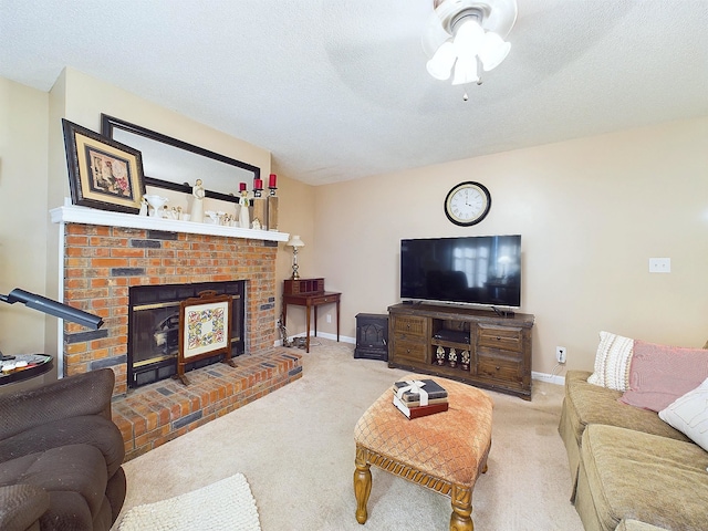 carpeted living room featuring a fireplace and a textured ceiling