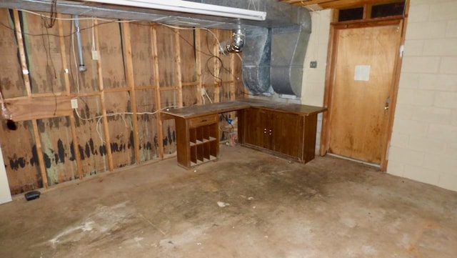  - unfinished basement with concrete block wall